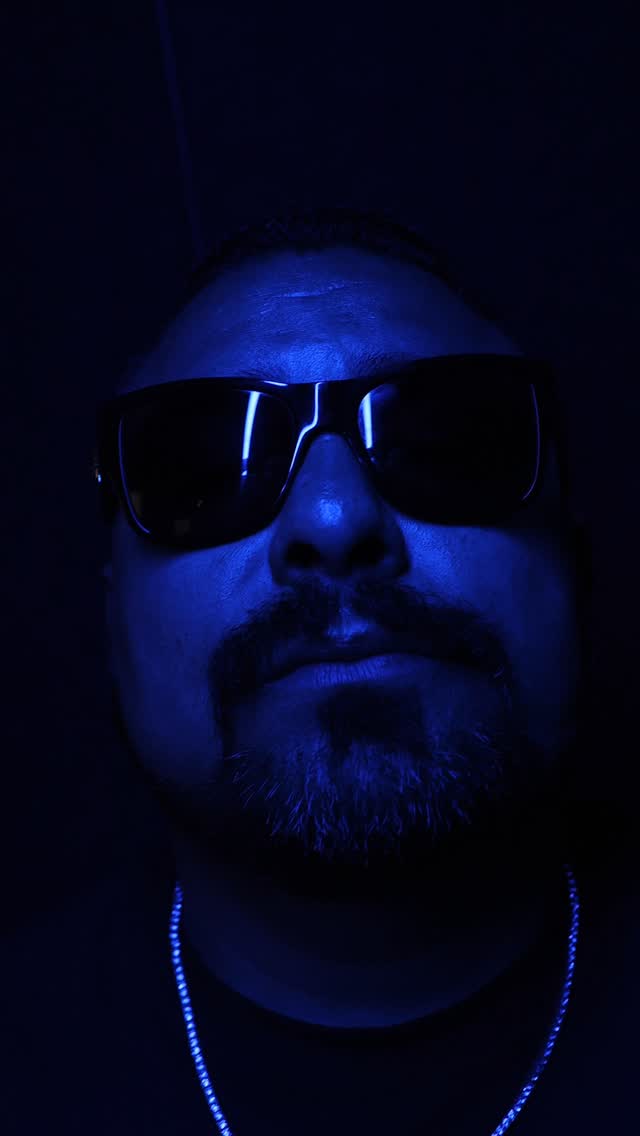 Packman562 in the blue light, shades on